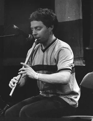 Diarmaid Moynihan playing Low Whistle into a microphone