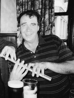 Finbar Fureyplaying a Low Whistle with three hands