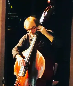 The co-author David not playing Low Whistle but playing Double Bass for contra dance