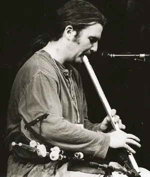Cillian Vallely playing Low Whistle, with pipes on his lap